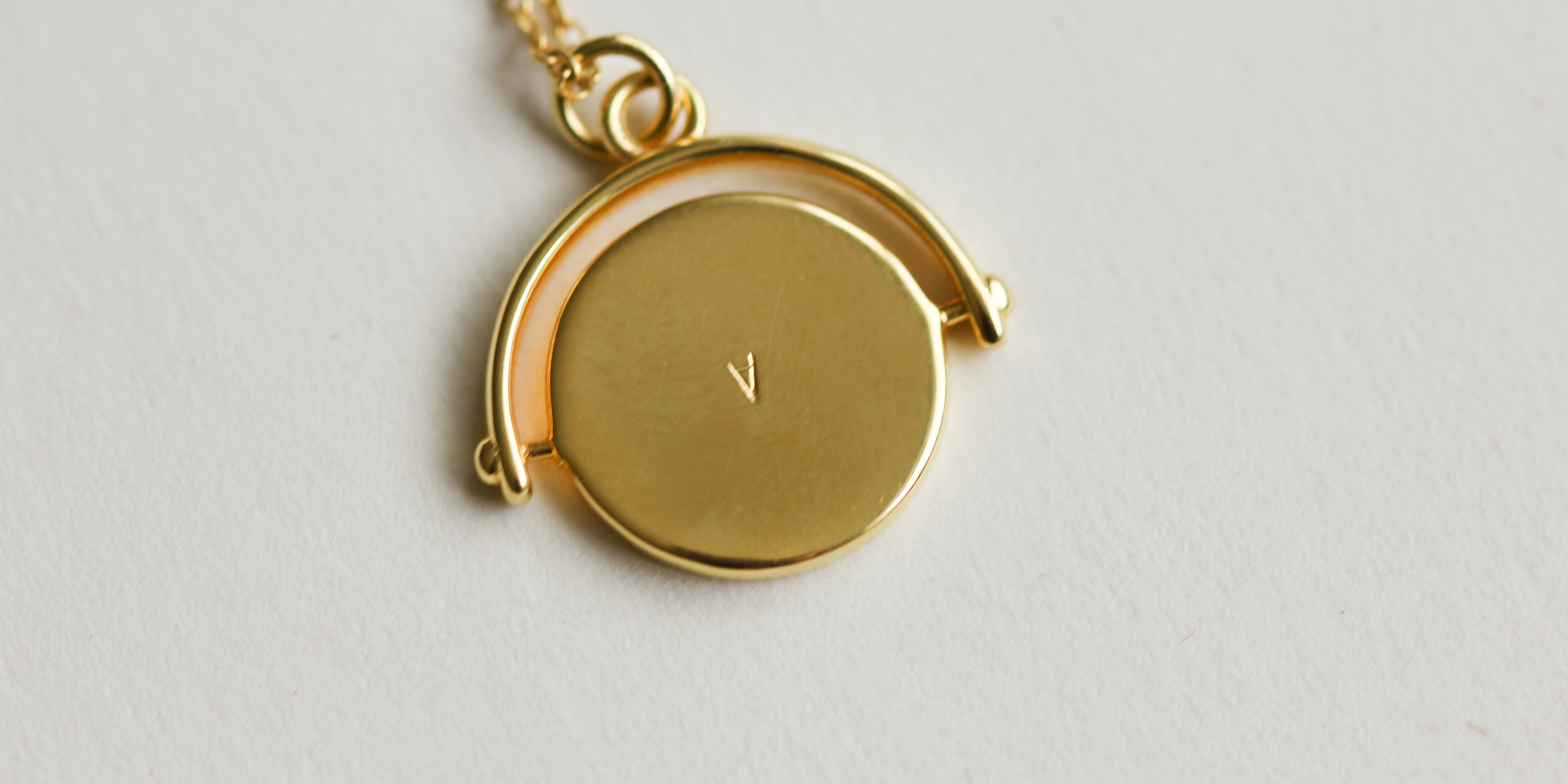 Plus present, gold initial necklace 