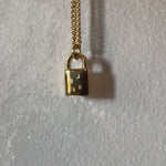 Multiple initial gold lock necklace 