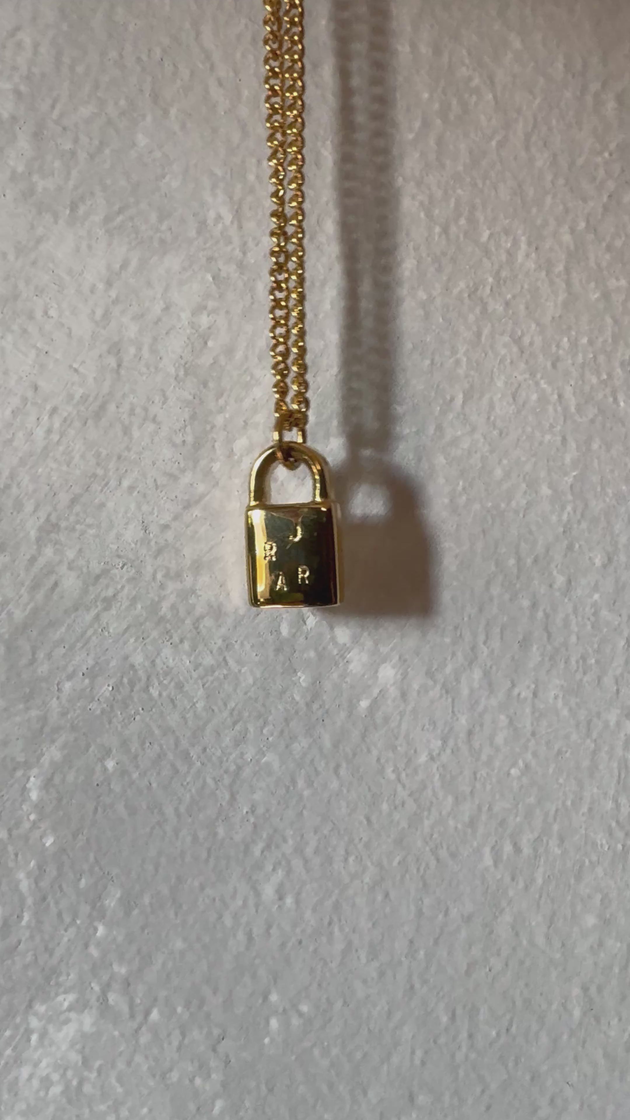 Multiple initial gold lock necklace 