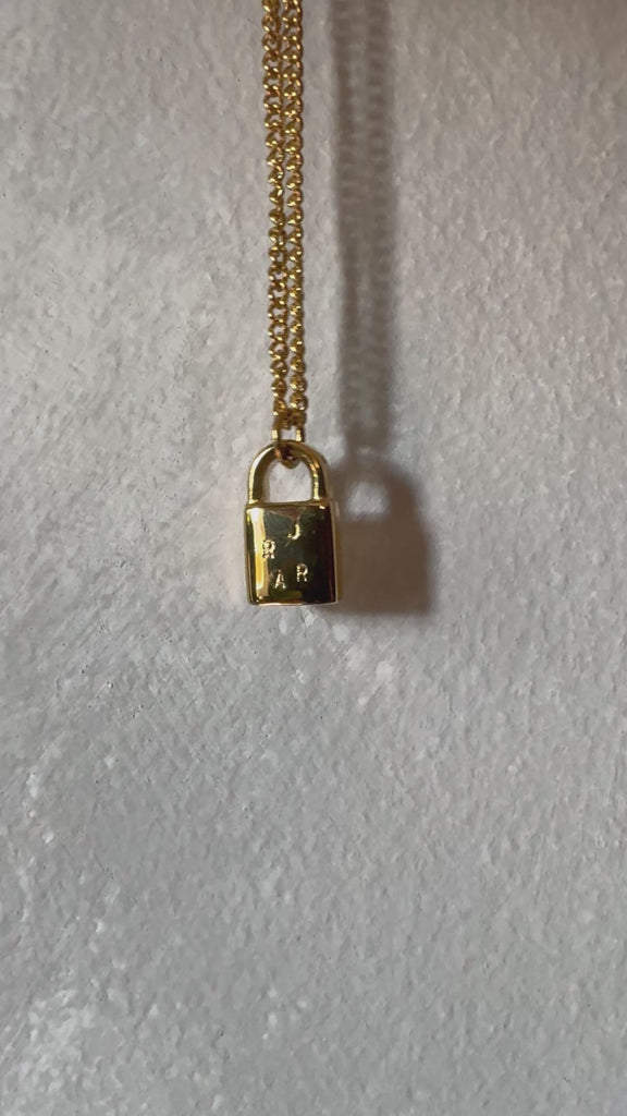 Multiple initial gold lock necklace 
